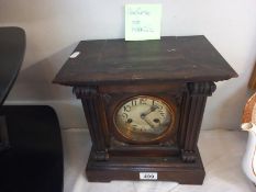 An Edwardian mantle clock with silvered dial, with pendulum, no key, both springs ok. Collect Only.