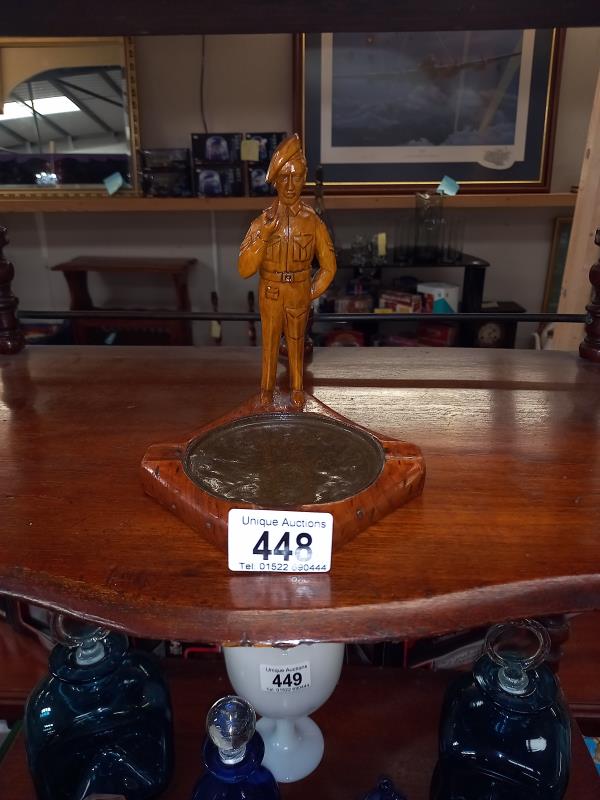 A vintage carved wooden figure of a corporal moulded as an ashtray.