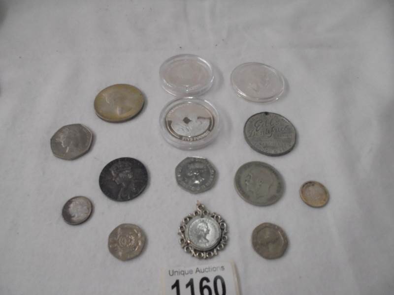 A mixed lot of coins including crowns, £2 and £5.