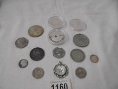 A mixed lot of coins including crowns, £2 and £5.