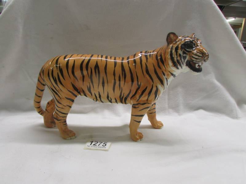 An 8" Beswick tiger.