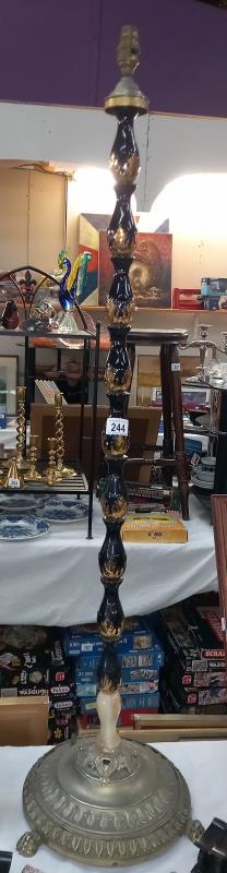 A vintage black and gold glazed standard lamp. Collect Only.