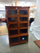 A mahogany minty oxford 5 piece sectional bookcase. ( 1 glass panel is cracked). COLLECT ONLY