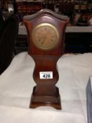 An Edwardian mahogany model of a Grandfather clock in working order. Height 33cm.