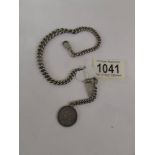 A silver watch chain with Victorian silver coin fob, 49 grams.