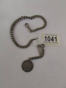 A silver watch chain with Victorian silver coin fob, 49 grams.