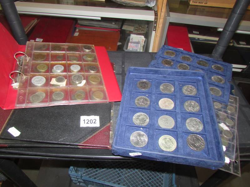 A mixed lot of modern crown coins, sixpences and two part filled albums.
