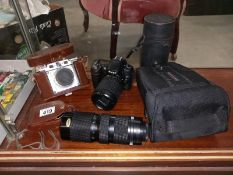 A Nikon digital camera. Photax Paragon lens. Also a vintage Gloria Braun Nurnberg 35mm camera.