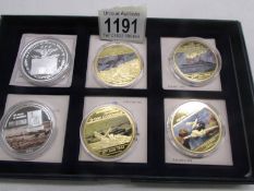 A set of six WW2 commemorative coins.