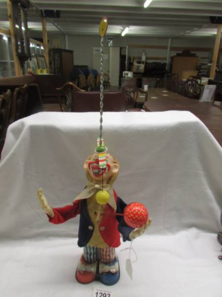 A tin plate juggling clown, made in Japan.
