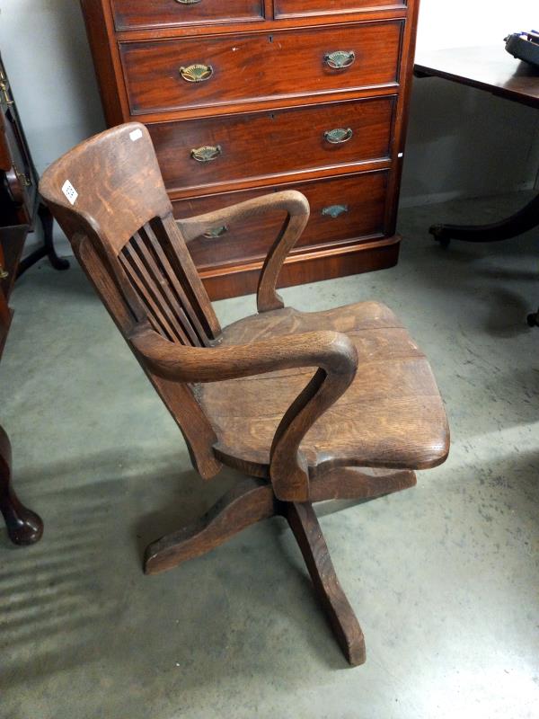 A 1920's oak industrial swivel office chair. Collect only. - Bild 3 aus 4