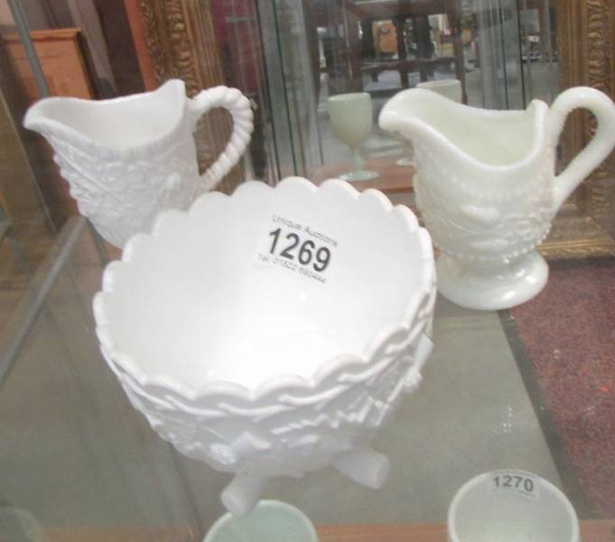 Two Victorian opaline glass milk jugs and a sugar bowl.