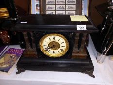 A 20th century slate mantel clock, springs ok.