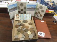 A mixed lot of coins etc.,