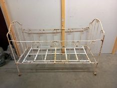 An early French folding metal child's cot. COLLECT ONLY.