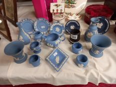 A varied selection of blue Wedgewood Jasperware various dishes etc