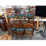 A mahogany oval extending dining table with one carver and five dining chairs, COLLECT ONLY.