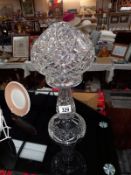 A 1930's heavy cut glass table lamp. Height 35cm.