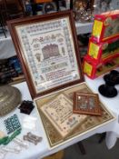 A large framed sampler dated 2004 and 3 others.
