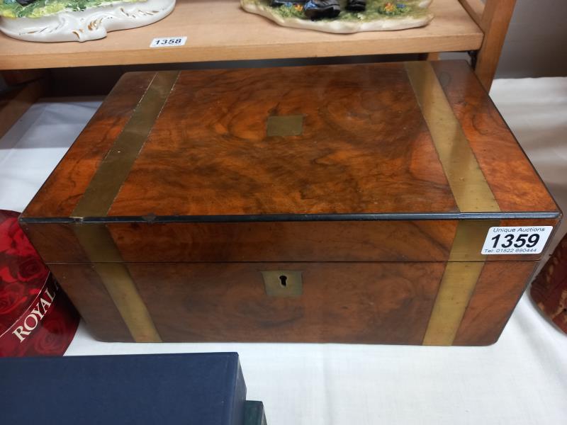 A Victorian mahogany brass banded writing box with ink bottles.