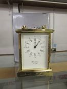 A boxed Woodford brass carriage clock.