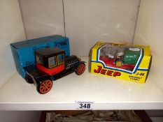 A boxed tin plate vintage style car & fire engine jeep