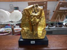 A large gilded Egyptian bust of Tutankhamun burial mask. Height 32cm base. 28.5cm x 18cm x 5cm.