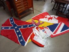 A quantity of old flags including Texas, Canada, Scotland, England, all printed. Approximate size