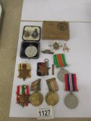 A mixed lot of medals and badges including WW2.