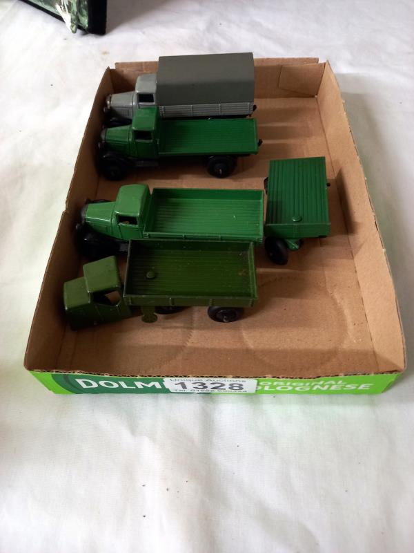 A DInky 25 series lorries 2x type 2 with smooth hubs, type 3 covered wagon pre war mechanical