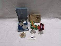 Three WW2 medals and two other medals.