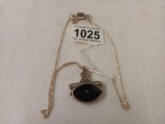 A silver and onyx art nouveau style double sided pendant.