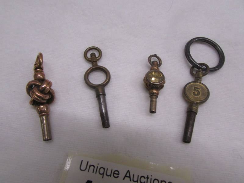 Four old pocket watch keys (one may be gold). - Image 2 of 2