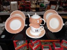 Susie Cooper salmon pink polka dot items. Tea pot, cream, 6 saucers, 5 side plates. (flea bites to