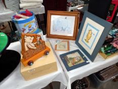 A collection of Winnie the Pooh items including Border fine arts wall plaque, boxed Schylling