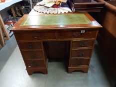 A good mid 20th century walnut pedestal desk with centre door