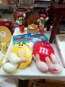 A selections of M&M's merchandise memorabilia including rucksacks, calculator etc.