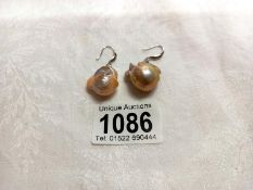 A pair of baroque pearl earrings