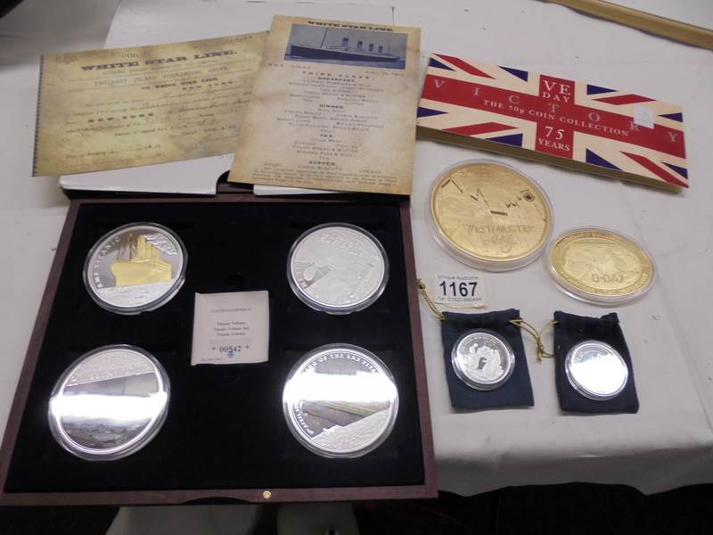 A cased set of 4 Titanic coins, Complete Victory 50p coin set, Icons of Britain 'Westminster Abbey'