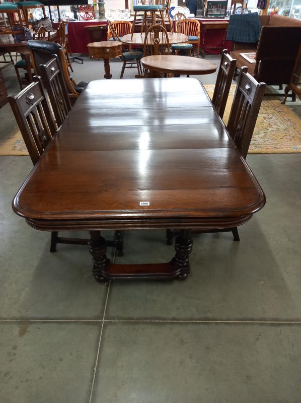 A 19/20th century French oak extending dining table with 3 leaves and a set of 4 chairs. 105cm x