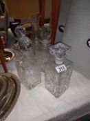 4 cut glass decanters including Royal Doulton, including a vase.
