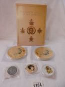 A cased set of 4 'Popes of the Modern Era' coins, 2 large George and the dragon coins, a smaller