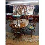 A good quality Ercol dining table with an extra leaf and six Ercol dining chairs, COLLECT ONLY.