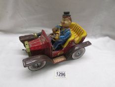 A Smokey Bill tin plate car.