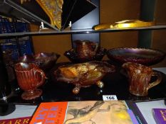 A quantity of mostly orange iridescent carnival glass