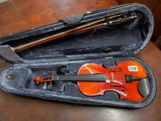 A Stagg violin in soft case. Length 28cm.