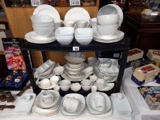 A large selection of white glazed dinner/table ware.