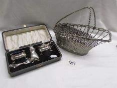 A cases silver plate cruet set and a wine bottle carrier.