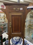 An Edwardian mahogany inlaid washstand with green tiled top COLLECT ONLY.