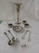 Three silver napkin rings, a silver dish, silver sugar tongs and a silver spill vase (82g exc. vase)